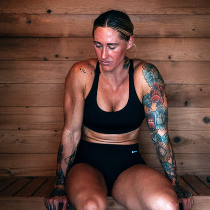 Sitting in a wooden outdoor 4 person sauna