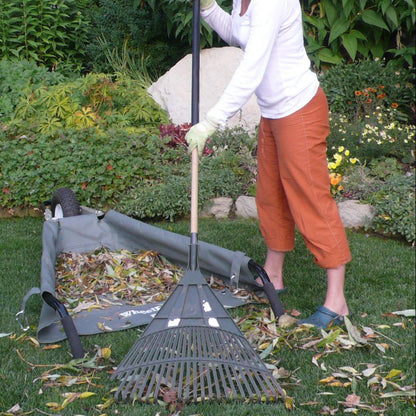Raking leaves in a collapsible garden cart in Colorado