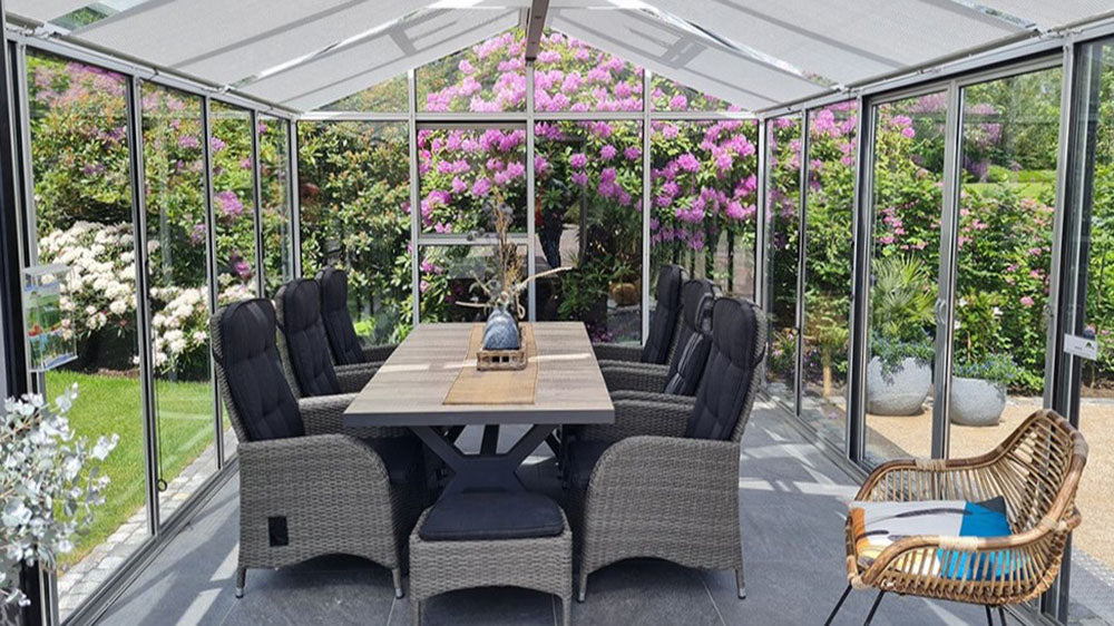 Livingten double pane glass greenhouse in a backyard garden