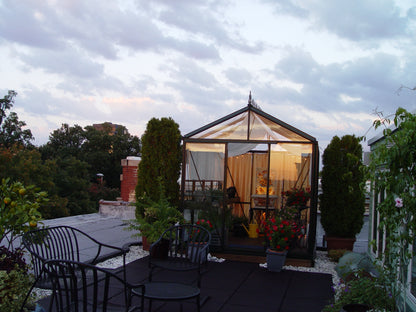 victorian greenhouse rooftop night lighting year-round Denver Colorado South Table Sheds